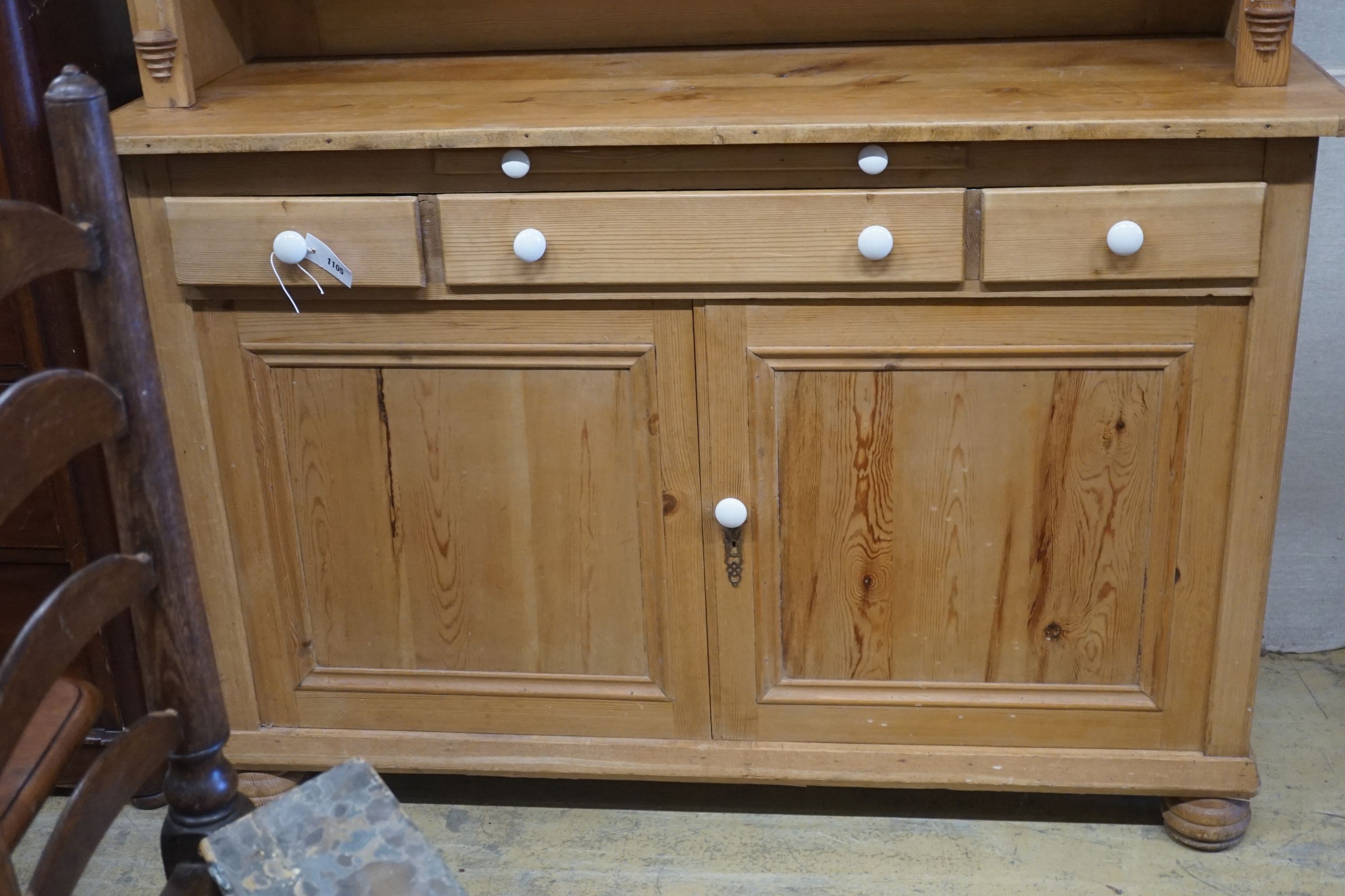 A 19th century Continental pine glazed side cabinet, width 142cm, depth 55cm, height 180cm